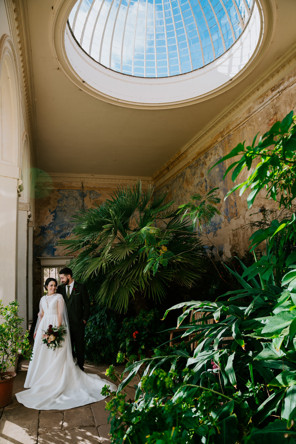 wedding photo of a couple in a conservatory 